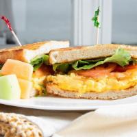 Breakfast Sandwich · Steamed scrambled eggs, artisan cheese, lettuce, tomatoes.  Add additional item for an addit...