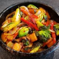 Brussels Vegetable Donburi · Vegetarian-friendly | bowl of steamed white rice topped with a stir-fry including (but not l...