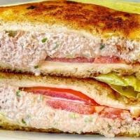 Tuna Melt · Tuna and swiss cheese on sourdough bread with tomatoes.