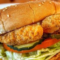 Crispy Chicken Strip Sandwich · Crispy Chicken tenders on white bun with mayo, lettuce, tomatoes, and pickles.