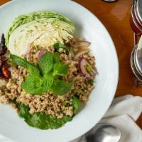 Larb · Your choice of meat and red onion, cilantro and crushed roasted rice in chili lime sauce.