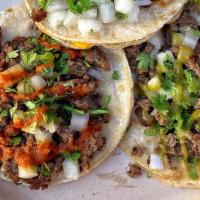 Street Tacos · Corn Tortilla, cilantro, onions & choice of salsa.