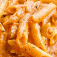 Penne Alla Vodka · Shallots and dill flambee with vodka in a creamy tomato sauce.