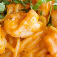Spaghetti Alla Cognac · Chopped jumbo shrimp, shallots and basil flambee with cognac in a light pink sauce.