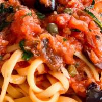 Linguine Alla Puttanesca · Kalamata olives, capers and anchovies garlic in a tomato sauce.