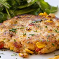 Jumbo Lump Crab Cake · Made with real crab meat with corn, cilantro and bell peppers on a bed of arugula and chipot...