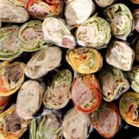 Deluxe Wrap Platter · Per Person. A Variety of Our Most Popular Sandwiches, On an Assortment of Wrap (Spinach, Sun...