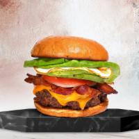 Bacon Point Burger · American beef patty cooked medium rare and topped with bacon, fried egg, avocado, mayonnaise...