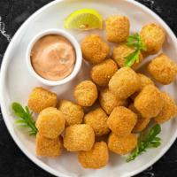 Crazy Tots · (Vegetarian) Shredded Idaho potatoes formed into tots, battered, and fried until golden brow...