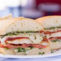 Pesto Chicken Sandwich · Grilled chicken, roasted red pepper, tomatoes, mozzarella cheese, mayo, and pesto.
