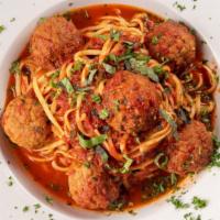 Spagheti & Meatball · Homemade marinara sauce, meatballs, basil over spaghetti.