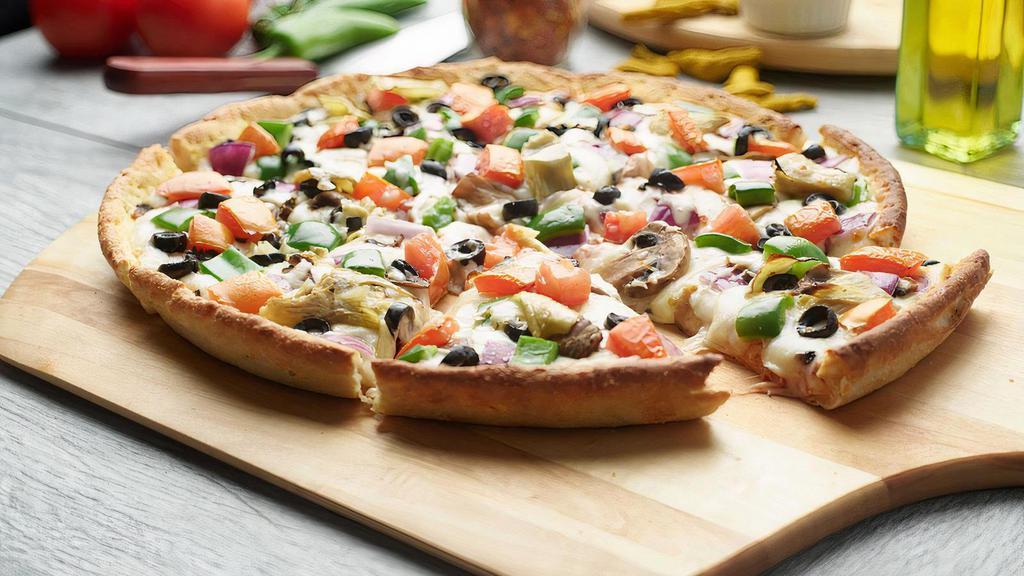 Vegenation Pizza · This pizza has our signature red sauce, fresh diced mozzarella cheese, fresh mushrooms, crisp red onions, fresh green peppers, sliced black olives, juicy tomatoes, and sliced artichoke hearts