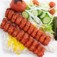  Ground Chicken Koubideh Platter  · Must try! Juicy, seasoned and grilled ground chicken skewers (2). Served on a bed of rice wi...