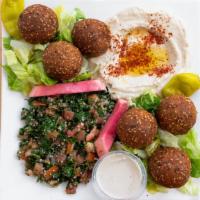 Vegetarian Platter · Hearty platter of falafel, hummus and tabouleh with side of pickles, tomatoes and tahini sau...