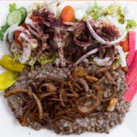  Mujadara · A traditional middle eastern dish of bulgur and lentils mixed in spices and topped with cara...