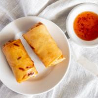 Egg Roll · Served with sweet and sour sauce and cucumber salad. Vegetarian.