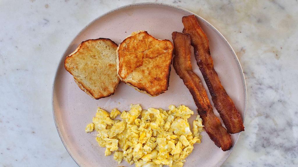Kids Egg, Bacon & Toast · One egg cooked to your liking with a side of our toast with one strip of bacon! Add on any extra sides!