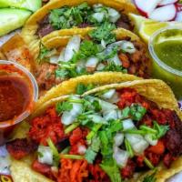 Tacos · Choice of protein, tortilla, cilantro, onion.