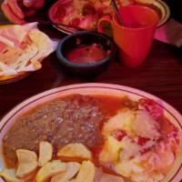 Huevos Rancheros · Corn tortilla topped with over easy eggs, salsa ranchera, and mozzarella cheese. Includes: R...