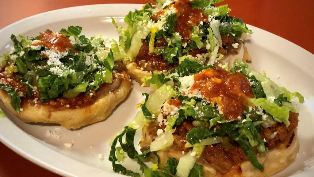 Order Of 3 Sopes · (3) Homemade sopes, topped with refried beans, choice of meat, lettuce, Mexican cheese, and salsa