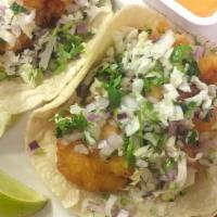 Taco Gobernador *New* · The Governor Taco!!!  Beer battered shrimp topped with cabbage, onions, and cilantro on a fr...