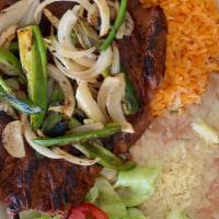 Carne Asada · Grilled arrachera steak with grilled onions, and jalapeño.