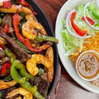 Fajitas · Grilled steak or chicken with sautéed peppers and onions, served with sour cream and guacamo...