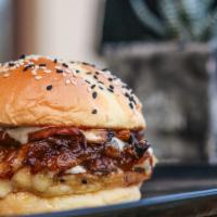 The Max Burger · Taste the Max Difference with our burger topped with Cheddar cheese, mushrooms, onions, baco...