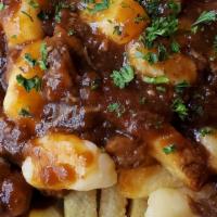 Poutine · House Cut Fries, Beef & Pork Belly Gravy & White Cheddar Cheese Curd