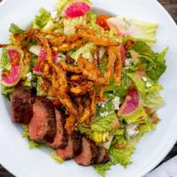 Steak Salad · Bistro Filet, Chopped Romaine, Crispy Onion Strings, Radish, Cherry Tomatoes, Blue Cheese Cr...