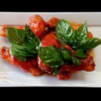 Thai Buffalo Wings · Spicy. Deep fried chicken wings glazed with bk spicy sauce. Topped with crispy basil.