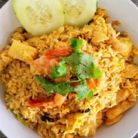 Pineapple Fried Rice · Chicken, shrimp, rice, egg, pineapple, onion, cashew nut, raisin, scallions and curry powder.