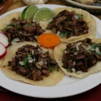 Four Tacos Plate · Four soft tacos with choice of meat, onions, and cilantro.
