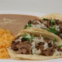 Two Tacos Combo · Two soft tacos with choice of meat topped with cilantro and onions. Served with rice and bea...