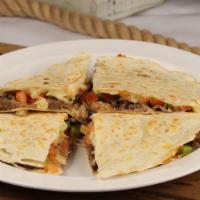 Quesadilla Sincronizada · Jack cheese quesadilla stuffed with choice of meat, tomato, onions, and bell pepper.