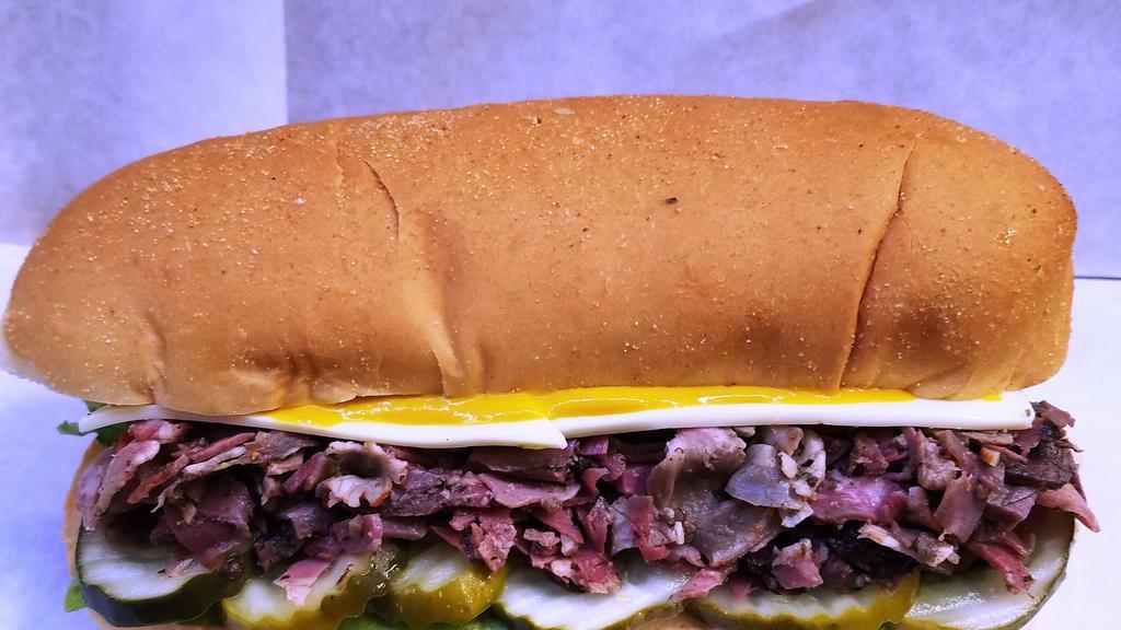 Pastrami Sandwich · On 8inch telera roll, grilled pastrami, pickles, mustard, cheese, special sauce.