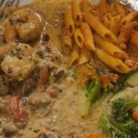 Pollo Buona Donna · Chicken breast and jumbo prawns sauteed with roasted red peppers, mushrooms, and cream.
