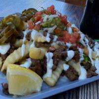 Asada Fries · Carne asada, french fries, refried beans, monterrey jack cheese, guacamole, pico de gallo, s...