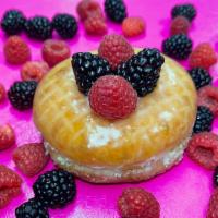 Custard & Berries Donut · A glazed donut filled with Bavarian cream, fresh raspberries and blackberries.