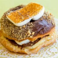 S’Mores  · A chocolate donut dipped in graham cracker, and filled with hershey’s and toasted marshmallo...