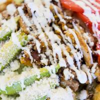 Taco Salad · Fried flour tortilla shell with beans, ground beef, cheese, guacamole, sour cream and lettuce.