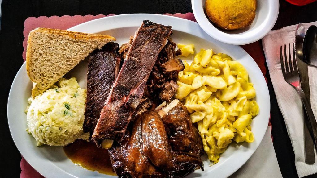 Three Meat · Choice of ribs, brisket, chicken, hot links, pulled pork,  or rib tips; each meal comes with 2 sides, (no double meats; Add double vegetables or double sides for an additional charge.