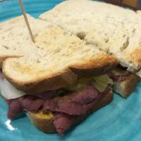 Pastrami · Mustard, swiss cheese, pickles on baguette bread.