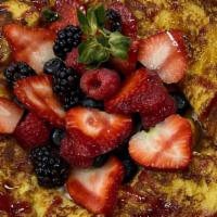 French Toast · Brioche with maple syrup, berry sauce, and fresh berries.