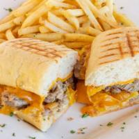 Steak Panini · Flank steak, ciabatta bread, chipotle, mayo, roasted bell pepper, caramelized onion, and Che...