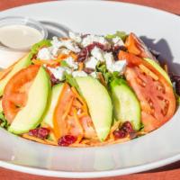 Arugula Salad · Arugula, cucumber, tomato, dried cranberry, avocado, shredded carrots, goat cheese, lemon, o...