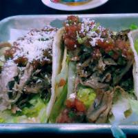 3 Fish Tacos · Hand-battered white fish, lime crema, cabbage, pico de gallo, cotija.