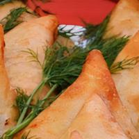 Samosa · Fried dish with a savoury filling and spices.