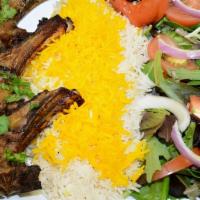 Biryani Goat · Fresh goat meat with rice and spices. Includes basmati rice and salad.