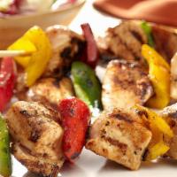 Chicken Kabob · Served on a bed of rice with BBQ Onion, Tomato, Garlic dip, and Armenian pickle.